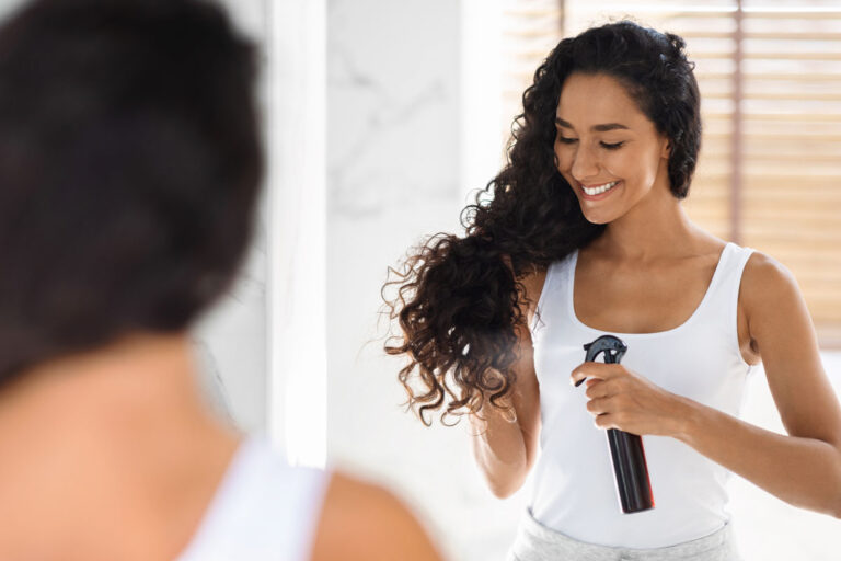 haircare beautiful young lady applying hair spray 2023 11 27 05 31 43 utc